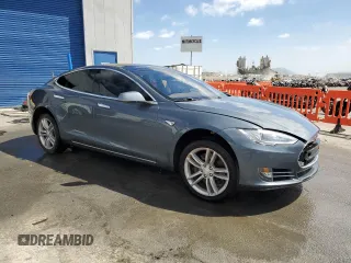 2013 Tesla Model S with VIN 5YJSA1CG9DFP09733, listed as a Copart auction lot 71574474 with 88,163 mi miles and Salvage title. Bid and sale history available at DreamBid. Image 4.