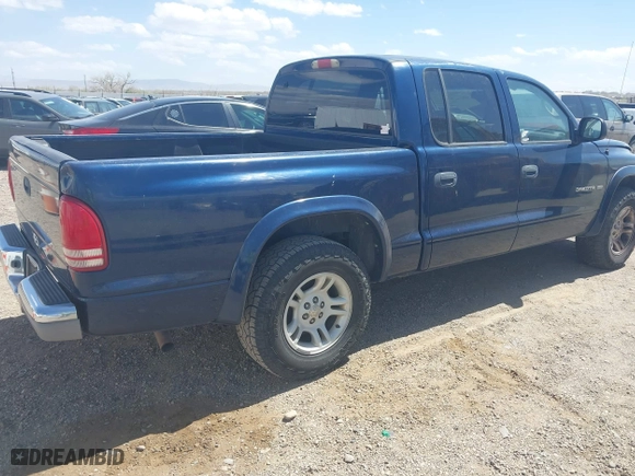 2002 Dodge Dakota SLT with VIN 1B7HL48N32S708719, listed as a IAAI auction lot 42027763 with 217,797 mi miles. Bid and sale history available at carsss.com. Image 4.