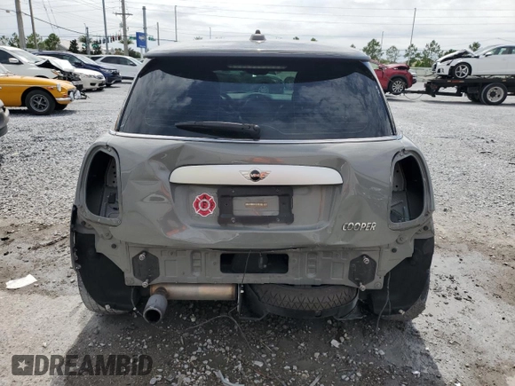 2014 MINI Hardtop with VIN WMWXM5C51ET934047, listed as a Copart auction lot 63039335 with 104,446 mi miles and Salvage title. Bid and sale history available at DreamBid. Image 6.
