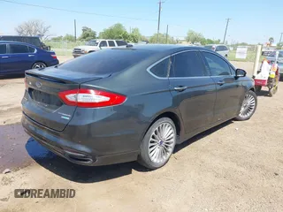 2016 Ford Fusion Titanium with VIN 3FA6P0K98GR158877, listed as a IAAI auction lot 41994013 with 57,027 mi miles and . Bid and sale history available at DreamBid. Image 4.