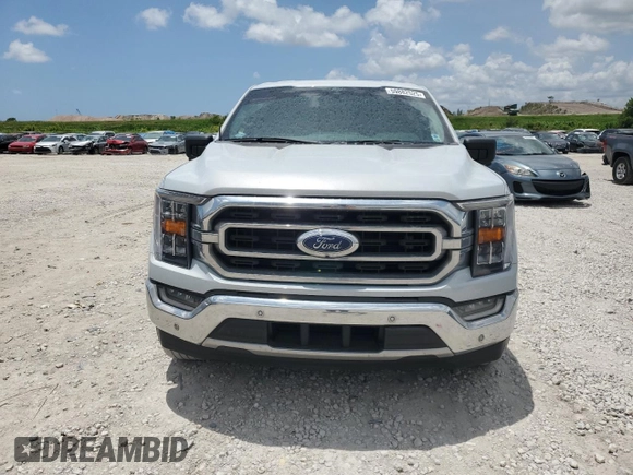 2021 Ford F-150 XL with VIN 1FTEW1CP2MKE62928, listed as a Copart auction lot 59882525 with 32,481 mi miles and Salvage title. Bid and sale history available at DreamBid. Image 5.