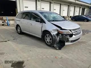 2012 Honda Odyssey EX-L with VIN 5FNRL5H60CB117376, listed as a Copart auction lot 50740725 with 163,716 mi miles and Salvage Title. Bid and sale history available at DreamBid. Image 11.