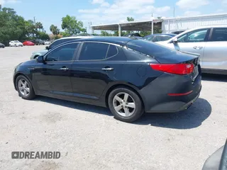 2014 Kia Optima LX with VIN 5XXGM4A78EG296882, listed as a IAAI auction lot 42126103 with 148,004 mi miles. Bid and sale history available at carsss.com. Image 3.
