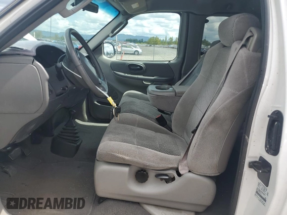 2002 Ford F-150 XL with VIN 1FTRX18L62KC53807, listed as a Copart auction lot 57463075 with 173,301 mi miles and Salvage title. Bid and sale history available at DreamBid. Image 7.
