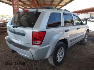 2005 Jeep Grand Cherokee Laredo z VIN 1J4HS48N65C563266, wystawiony jako IAAI lot #42784524 z przebiegiem 156 702 mil mil oraz . Historia ofert i sprzedaży dostępna na DreamBid. Obrazek 4.