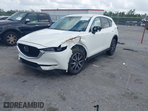 2018 Mazda CX-5 Touring z VIN JM3KFACM6J1419663, wystawiony jako IAAI lot #41879677 z przebiegiem 115 224 mil mil oraz . Historia ofert i sprzedaży dostępna na DreamBid. Obrazek 22.