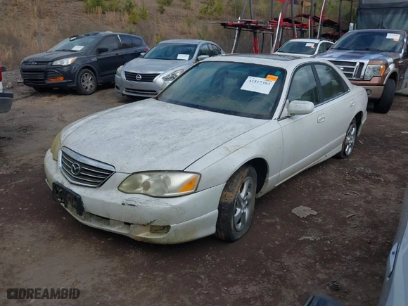 2001 Mazda Millenia with VIN JM1TA221211708077, listed as a IAAI auction lot 41517393 with NaN miles. Bid and sale history available at carsss.com. Image 2.