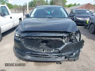 2018 Mazda CX-5 Touring z VIN JM3KFBCM9J0358997, wystawiony jako IAAI lot #42332606 z przebiegiem 93 952 mil mil oraz . Historia ofert i sprzedaży dostępna na DreamBid. Obrazek 12.