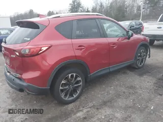 2016 Mazda CX-5 Grand Touring with VIN JM3KE4DY6G0740347, listed as a IAAI auction lot 41101437 with 81,586 mi miles. Bid and sale history available at carsss.com. Image 4.