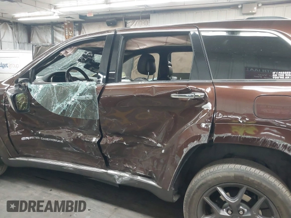 2014 Jeep Grand Cherokee Summit with VIN 1C4RJFJT6EC346575, listed as a IAAI auction lot 41881795 with 148,941 mi miles and . Bid and sale history available at DreamBid. Image 6.