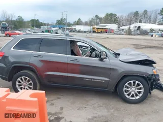 2014 Jeep Grand Cherokee Laredo with VIN 1C4RJEAG1EC573704, listed as a IAAI auction lot 41864355 with 141,970 mi miles. Bid and sale history available at carsss.com. Image 14.
