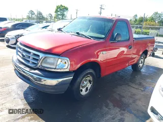 1999 Ford F-150 with VIN 1FTZF1723XNA23062, listed as a IAAI auction lot 42019826 with 232,648 mi miles and . Bid and sale history available at DreamBid. Image 2.