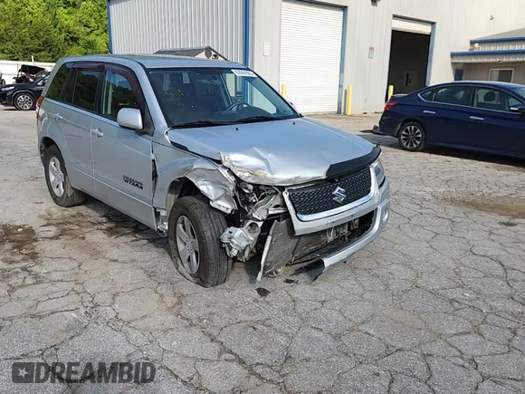 2011 Suzuki Grand Vitara Premium z VIN JS3TD0D29B4103041, wystawiony jako Copart lot #62066985 z przebiegiem 219 727 mil mil oraz Szkoda całkowita • Salvage title. Historia ofert i sprzedaży dostępna na DreamBid. Obrazek 14.