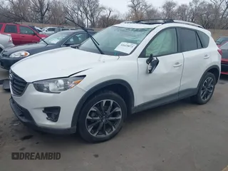 2016 Mazda CX-5 Grand Touring z VIN JM3KE2DY8G0885006, wystawiony jako IAAI lot #41615873 z przebiegiem 118 890 mil mil oraz . Historia ofert i sprzedaży dostępna na DreamBid. Obrazek 2.