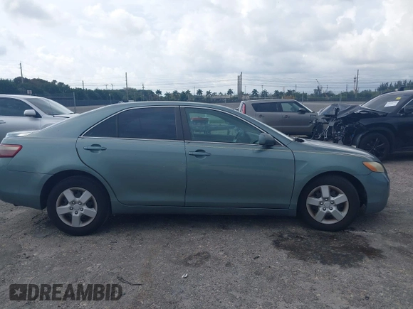 2007 Toyota Camry CE with VIN 4T1BE46K37U569515, listed as a IAAI auction lot 41974482 with 242,042 mi miles. Bid and sale history available at carsss.com. Image 13.