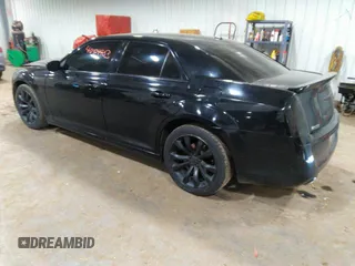 2014 Chrysler 300 S with VIN 2C3CCABG2EH343503, listed as a IAAI auction lot 40934463 with 128,876 mi miles and . Bid and sale history available at carsss.com. Image 3.