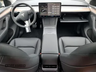 2025 Tesla Model Y Long Range with VIN 7SAYGDEE5SF296652, listed as a Copart auction lot 46664465 with 452 mi miles and Salvage Title. Bid and sale history available at DreamBid. Image 8.