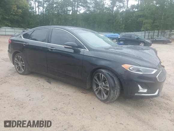 2019 Ford Fusion Titanium with VIN 3FA6P0K9XKR217324, listed as a Copart auction lot 56104185 with 135,728 mi miles and Salvage title. Bid and sale history available at DreamBid. Image 4.