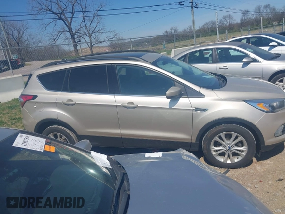 2017 Ford Escape SE with VIN 1FMCU0GD3HUC94245, listed as a IAAI auction lot 41877799 with 214,571 mi miles. Bid and sale history available at carsss.com. Image 13.