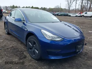 2020 Tesla Model 3 Standard Range Plus with VIN 5YJ3E1EA1LF658521, listed as a IAAI auction lot 41804722 with 83,248 mi miles and . Bid and sale history available at DreamBid. Image 1.