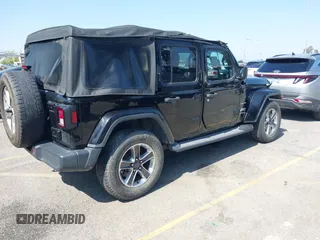 2018 Jeep Wrangler Unlimited Sahara with VIN 1C4HJXEN7JW328981, listed as a IAAI auction lot 42217508 with 59,584 mi miles and . Bid and sale history available at DreamBid. Image 4.