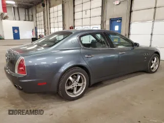 2005 Maserati Quattroporte z VIN ZAMCE39A350017390, wystawiony jako Copart lot #72455664 z przebiegiem 50 394 mil mil oraz Szkoda całkowita • Salvage title. Historia ofert i sprzedaży dostępna na DreamBid. Obrazek 3.