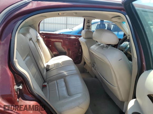 2000 Lincoln Town Car Signature with VIN 1LNHM82W2YY809189, listed as a Copart auction lot 59812665 with 148,236 mi miles and Salvage title. Bid and sale history available at DreamBid. Image 10.