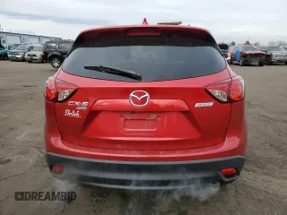 2014 Mazda CX-5 Grand Touring with VIN JM3KE4DY5E0360896, listed as a Copart auction lot 43978975 with 113,942 mi miles and Salvage Title. Bid and sale history available at carsss.com. Image 6.