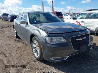 2017 Chrysler 300 with VIN 2C3CCAEG2HH559755, listed as a IAAI auction lot 41854444 with 135,744 mi miles. Bid and sale history available at carsss.com. Image 1.