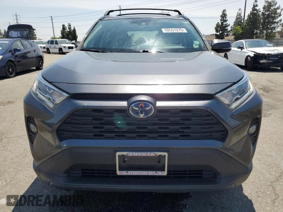 2020 Toyota RAV4 Hybrid XLE with VIN JTMRWRFV7LD063381, listed as a Copart auction lot 60661275 with 70,544 mi miles and Salvage title. Bid and sale history available at DreamBid. Image 5.
