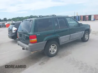1998 Jeep Grand Cherokee Laredo with VIN 1J4GZ58S7WC284106, listed as a IAAI auction lot 42558498 with 316,354 mi miles and . Bid and sale history available at DreamBid. Image 4.