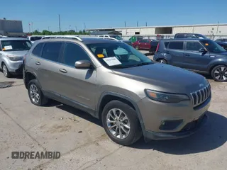 2019 Jeep Cherokee Latitude Plus with VIN 1C4PJMLBXKD233749, listed as a IAAI auction lot 41937698 with 103,988 mi miles. Bid and sale history available at carsss.com. Image 1.