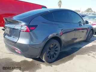 2022 Tesla Model Y Long Range with VIN 7SAYGDEE4NF522698, listed as a IAAI auction lot 41287885 with 82,306 mi miles. Bid and sale history available at carsss.com. Image 4.