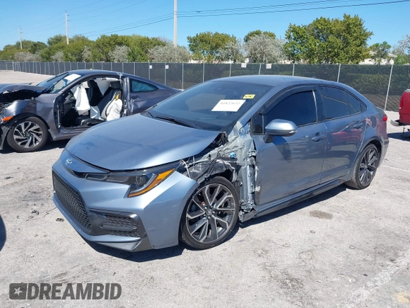 2021 Toyota Corolla SE with VIN JTDS4MCE1MJ063524, listed as a IAAI auction lot 41822622 with 50,882 mi miles. Bid and sale history available at carsss.com. Image 2.