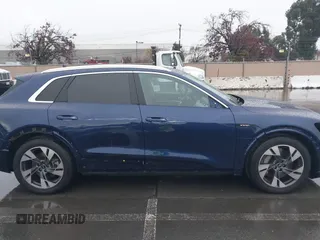 2022 Audi e-tron Premium Plus with VIN WA1LAAGE5NB022695, listed as a IAAI auction lot 41181338 with 14,711 mi miles and . Bid and sale history available at DreamBid. Image 14.