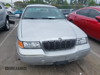 2001 Mercury Grand Marquis LS z VIN 2MEFM75W91X655747, wystawiony jako IAAI lot #42041090 z przebiegiem 138 906 mil mil oraz . Historia ofert i sprzedaży dostępna na DreamBid. Obrazek 6.