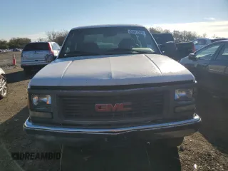 1999 GMC Sierra 1500 with VIN 1GTGC33RXXF096504, listed as a Copart auction lot 80027354 with 124,430 mi miles and Clean Title. Bid and sale history available at DreamBid. Image 5.