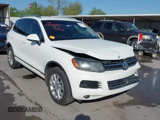 2012 Volkswagen Touareg Sport with VIN WVGFK9BP0CD003623, listed as a IAAI auction lot 42001326 with 140,140 mi miles and . Bid and sale history available at DreamBid. Image 1.