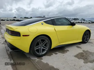 2023 Nissan Z Sport z VIN JN1BZ4AH0PM310987, wystawiony jako Copart lot #74926264 z przebiegiem 10 474 mil mil oraz Szkody całkowita. Historia ofert i sprzedaży dostępna na DreamBid. Obrazek 3.
