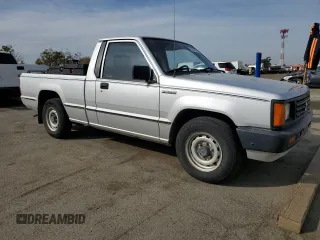 1988 Mitsubishi Mighty Max z VIN JA7FL24D2JP013297, wystawiony jako Copart lot #79533724 z przebiegiem 117 397 mil mil oraz Tytuł czysty. Historia ofert i sprzedaży dostępna na DreamBid. Obrazek 4.