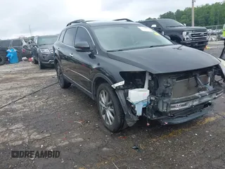 2015 Mazda CX-9 Grand Touring with VIN JM3TB2DA1F0464517, listed as a IAAI auction lot 42484985 with 104,932 mi miles and . Bid and sale history available at DreamBid. Image 1.