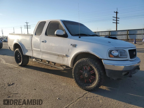 2000 Ford F-150 XL with VIN 1FTRX18L3YKA09007, listed as a Copart auction lot 42828005 with 218,563 mi miles and Salvage Title. Bid and sale history available at carsss.com. Image 4.