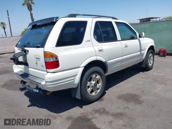1999 Isuzu Rodeo S with VIN 4S2CK58W7X4325703, listed as a IAAI auction lot 42715480 with 205,420 mi miles and . Bid and sale history available at DreamBid. Image 4.