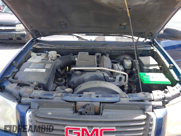 2004 GMC Envoy SLE with VIN 1GKDT13S242391968, listed as a IAAI auction lot 42079420 with 234,611 mi miles. Bid and sale history available at carsss.com. Image 10.