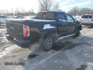 2015 GMC Canyon 4WD SLE z VIN 1GTG6BE31F1270675, wystawiony jako IAAI lot #41407183 z przebiegiem 143 117 mil mil oraz . Historia ofert i sprzedaży dostępna na DreamBid. Obrazek 4.