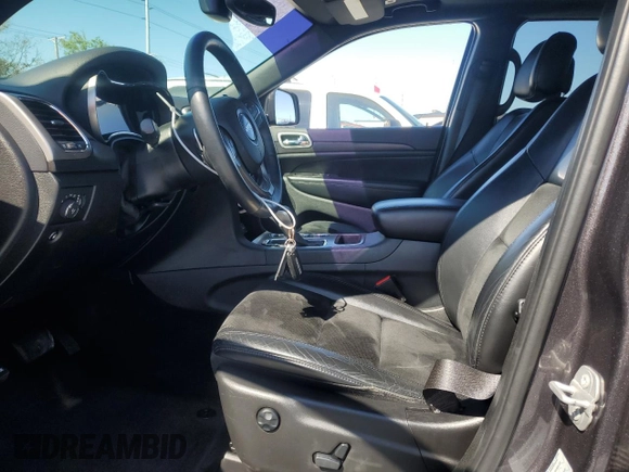 2017 Jeep Grand Cherokee 75th Anniversary with VIN 1C4RJEAG4HC700191, listed as a Copart auction lot 52520655 with 130,828 mi miles and Salvage title. Bid and sale history available at DreamBid. Image 7.