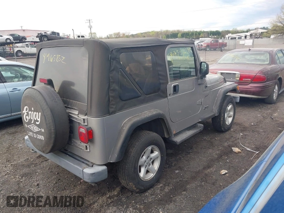 2002 Jeep Wrangler Sport with VIN 1J4FA49SX2P706691, listed as a IAAI auction lot 41965852 with 179,553 mi miles. Bid and sale history available at carsss.com. Image 4.