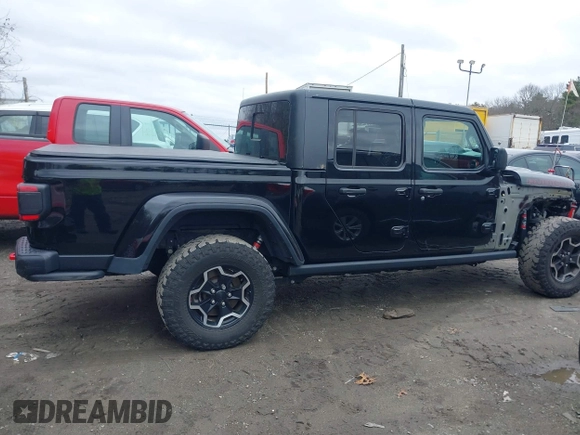 2021 Jeep Gladiator Rubicon z VIN 1C6JJTBG8ML524215, wystawiony jako IAAI lot #41829990 z przebiegiem 62 942 mil mil oraz . Historia ofert i sprzedaży dostępna na DreamBid. Obrazek 14.