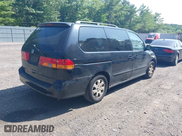 2003 Honda Odyssey EX-L with VIN 5FNRL18003B042487, listed as a IAAI auction lot 42604399 with 188,126 mi miles and . Bid and sale history available at DreamBid. Image 4.