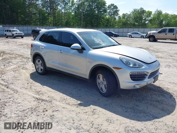 2012 Porsche Cayenne S Hybrid z VIN WP1AE2A20CLA92424, wystawiony jako IAAI lot #42315279 z przebiegiem 129 119 mil mil oraz . Historia ofert i sprzedaży dostępna na DreamBid. Obrazek 1.
